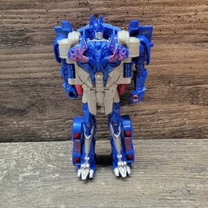 Transformers Reveal the Shield 1-Step Turbo Changer Optimus Prime Target Figure